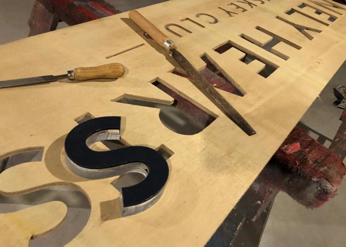 Routered wood signage